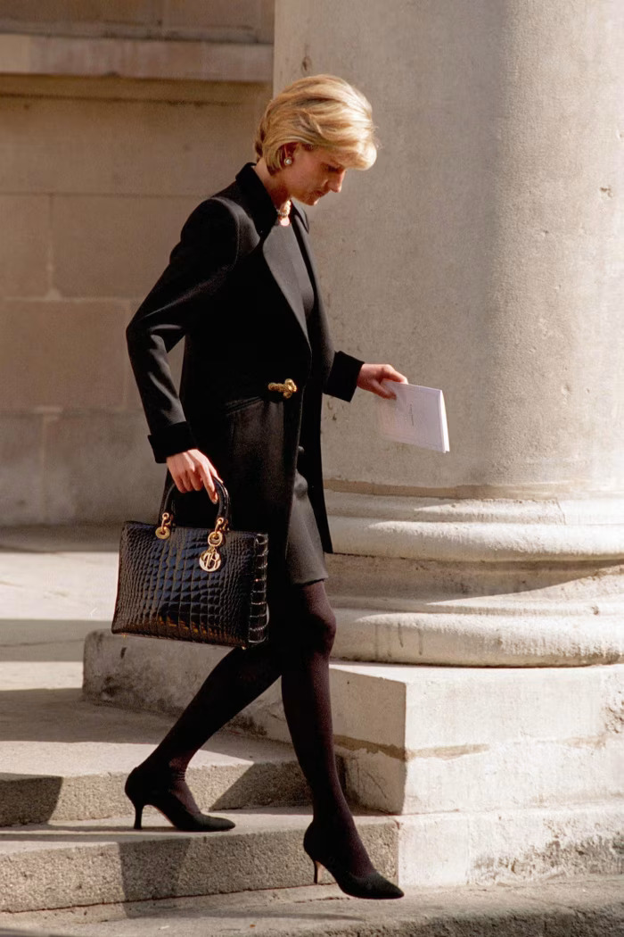 Diana, Princess of Wales, carrying a Lady Dior bag at the memorial service of photographer Terence Donovan, March 1997. Photo Credit: Tim Graham Photo Library via Getty Images