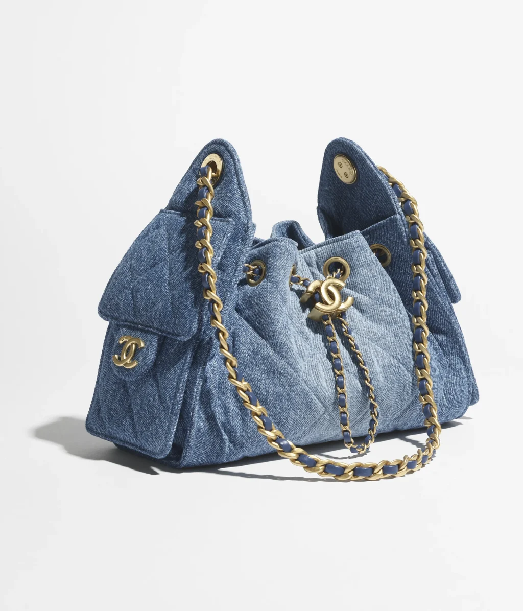 CHANEL 25 MINI HANDBAG / Washed Denim & Gold-Tone Metal / Blue / $5,700