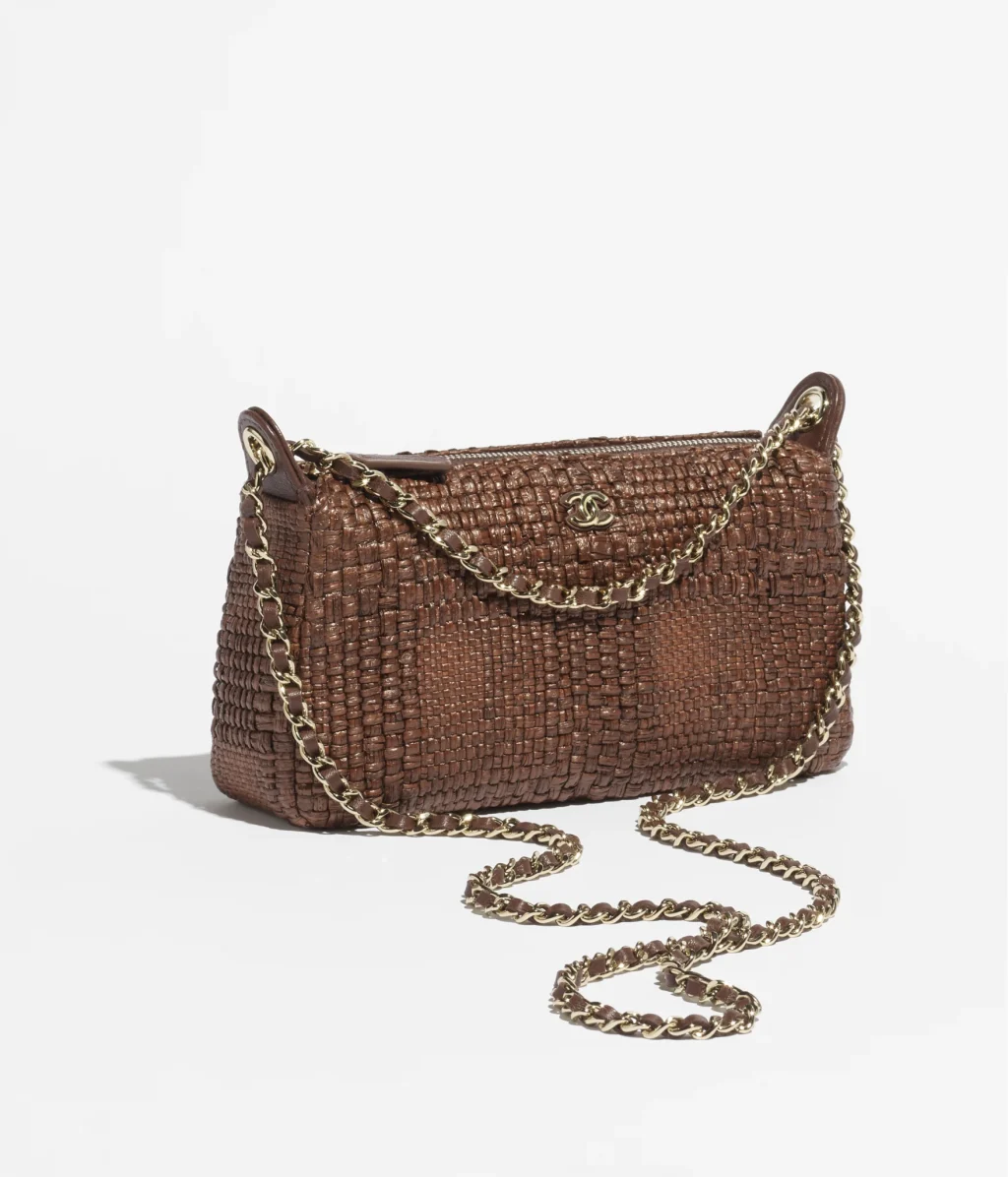 28. CHANEL CLUTCH WITH CHAIN / Braided Raffia & Gold-Tone Metal / Brown / $3,375