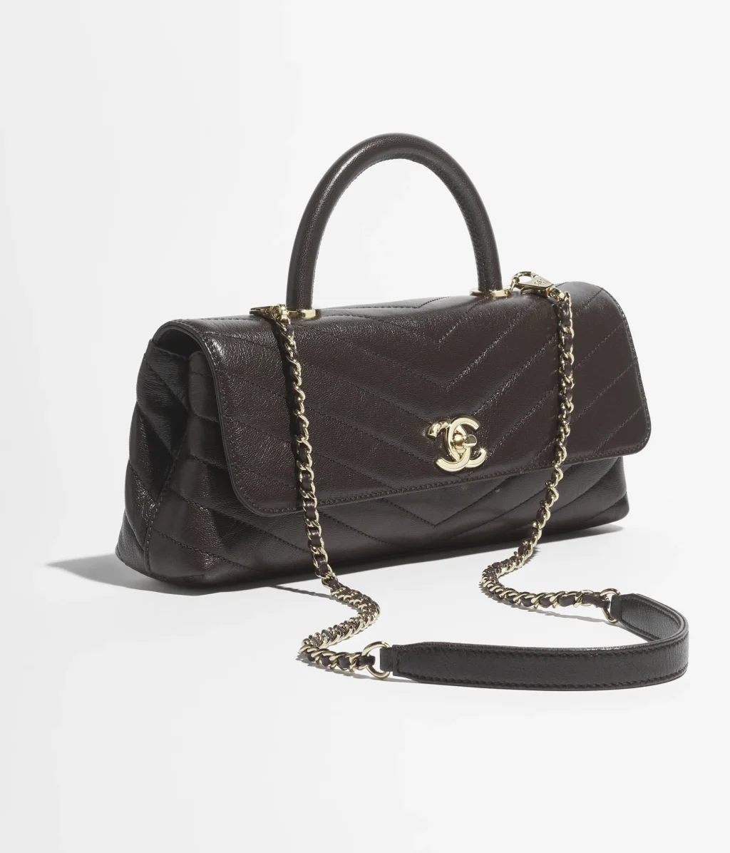 CHANEL MAXI FLAP BAG WITH TOP HANDLE / Goatskin & Gold-Tone Metal / Dark Brown / $6,700