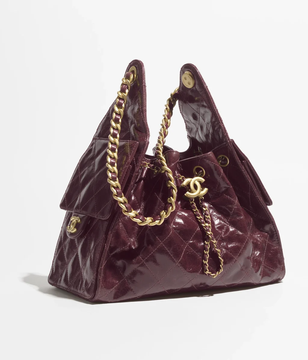 43. CHANEL 25 SMALL HANDBAG / Shiny Crumpled Calfskin & Gold-Tone Metal / Burgundy / $6,400