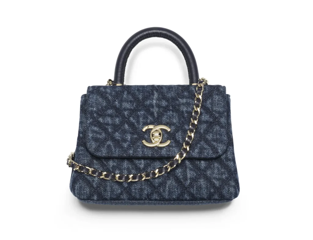 CHANEL CLUTCH WITH CHAIN / Washed Denim, Calfskin & Gold-Tone Metal / Blue / $3,500
