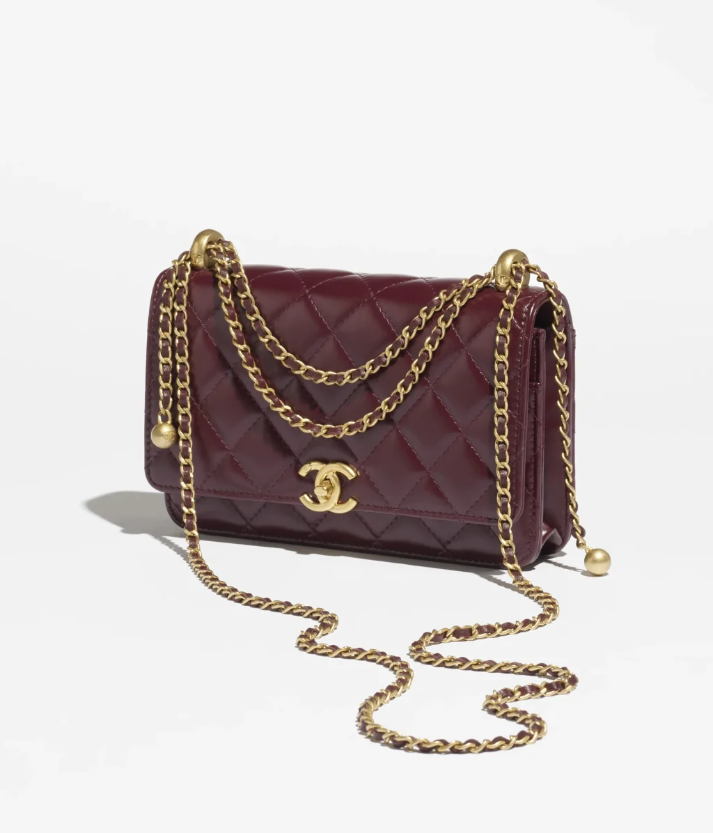 CHANEL WALLET ON CHAIN / Shiny Calfskin & Gold-Tone Metal / Dark Burgundy / $4,375