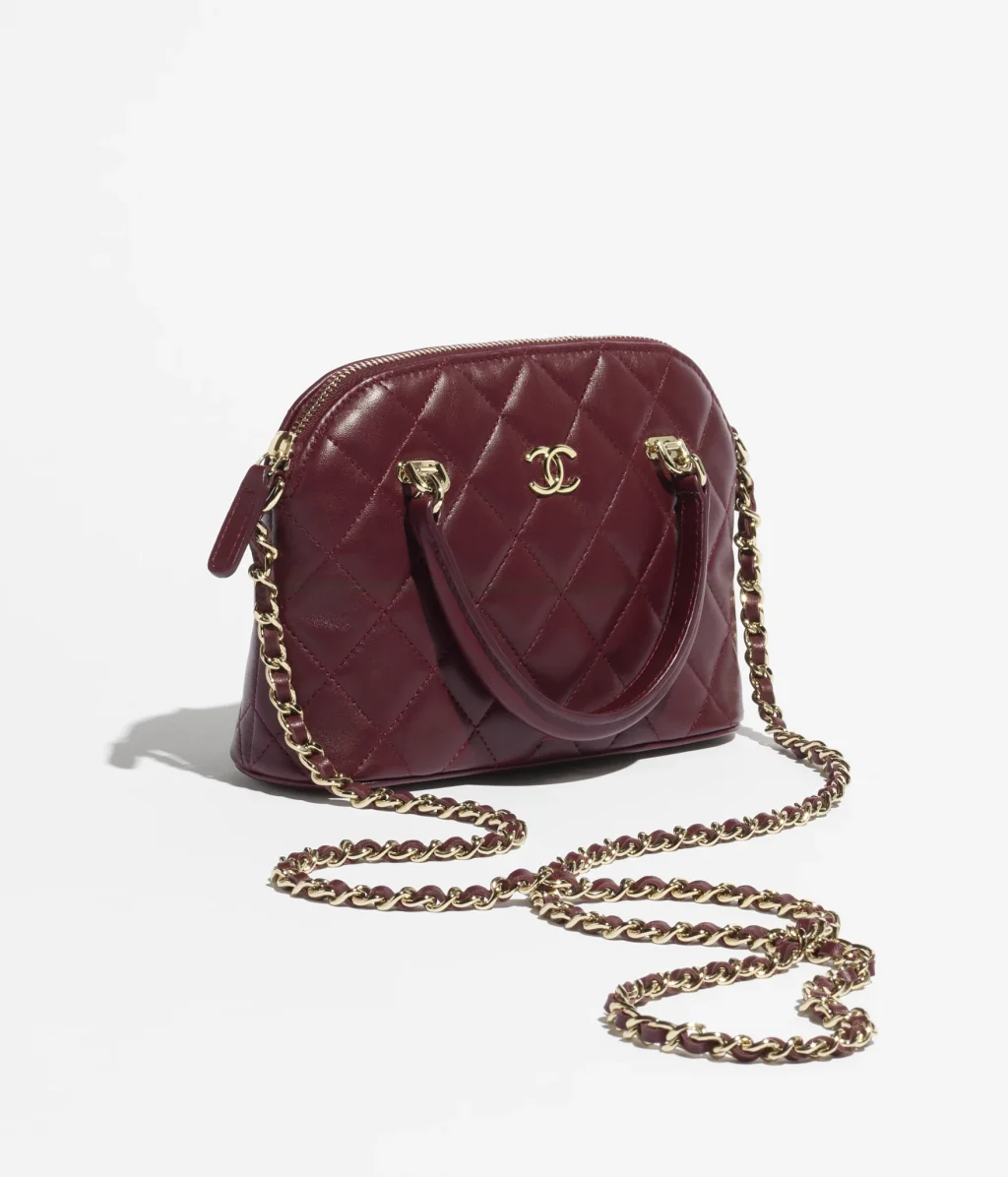 CHANEL CLUTCH WITH CHAIN / Lambskin & Gold-Tone Metal / Dark Burgundy / $3,700