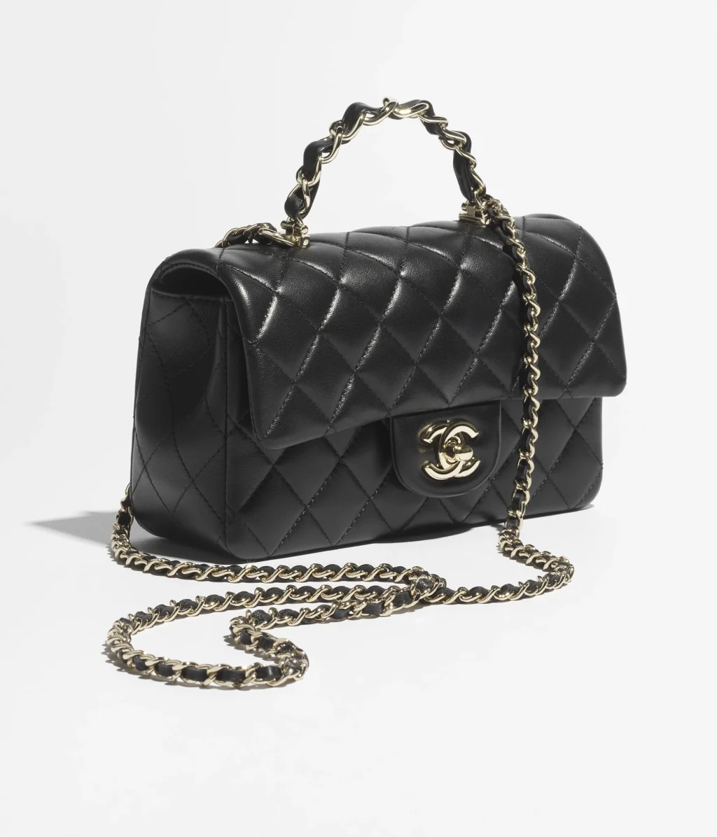 CHANEL MINI CLASSIC HANDBAG WITH TOP HANDLE / Lambskin & Gold-Tone Metal / Black / $6,300