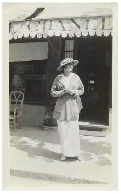 Gabrielle Chanel in front of her boutique in Deauville, 1913